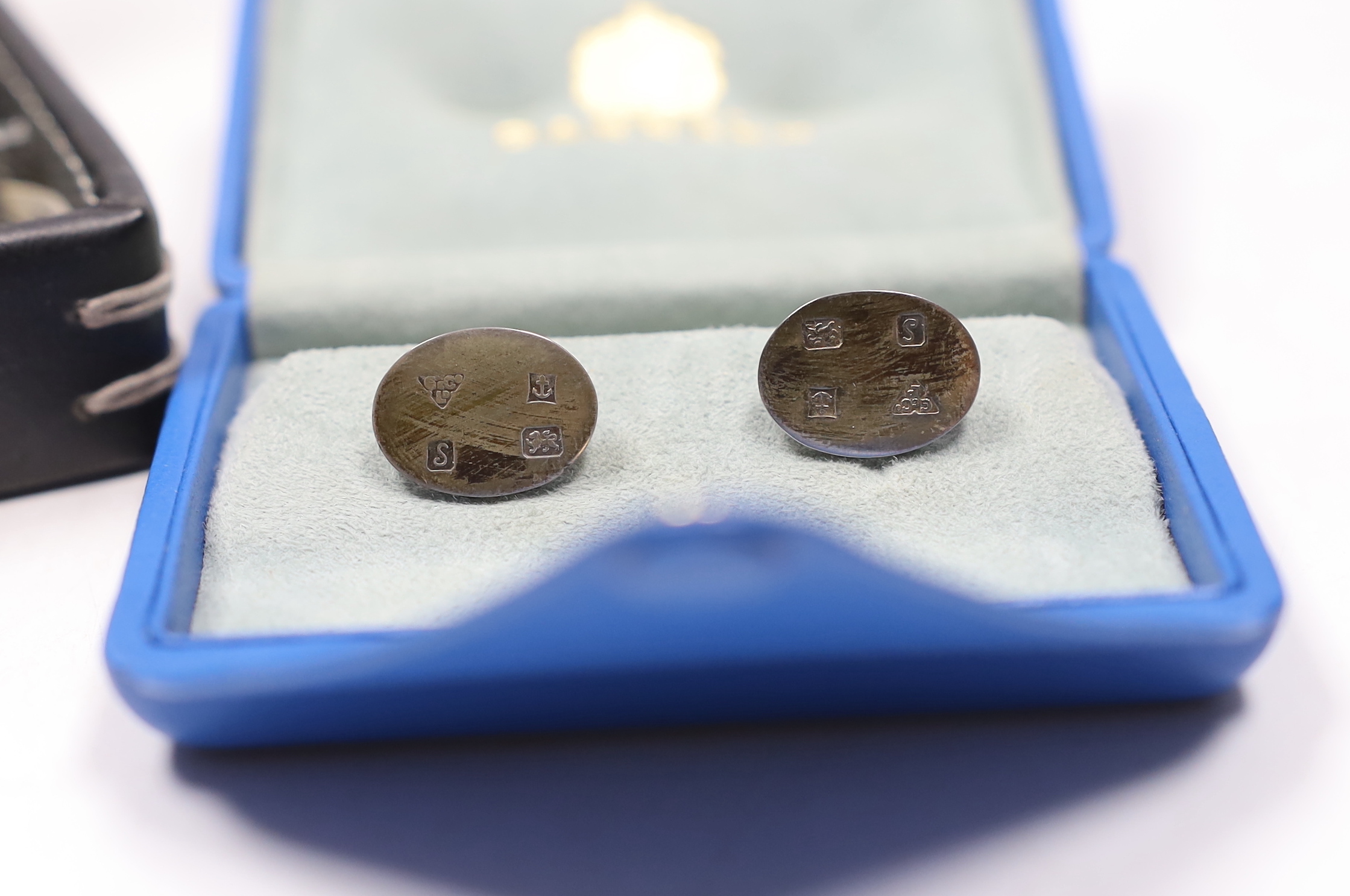Six assorted pairs of white metal cufflinks, three stamped 925 and one silver pair by Garrard & Co, in original box.